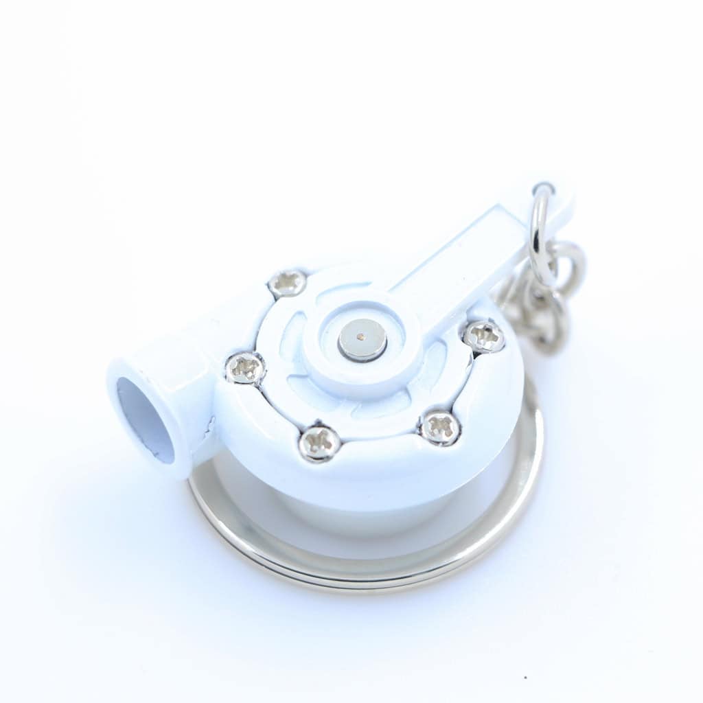Decorative white car engine component keychain with metal accents, suitable for automotive enthusiasts.