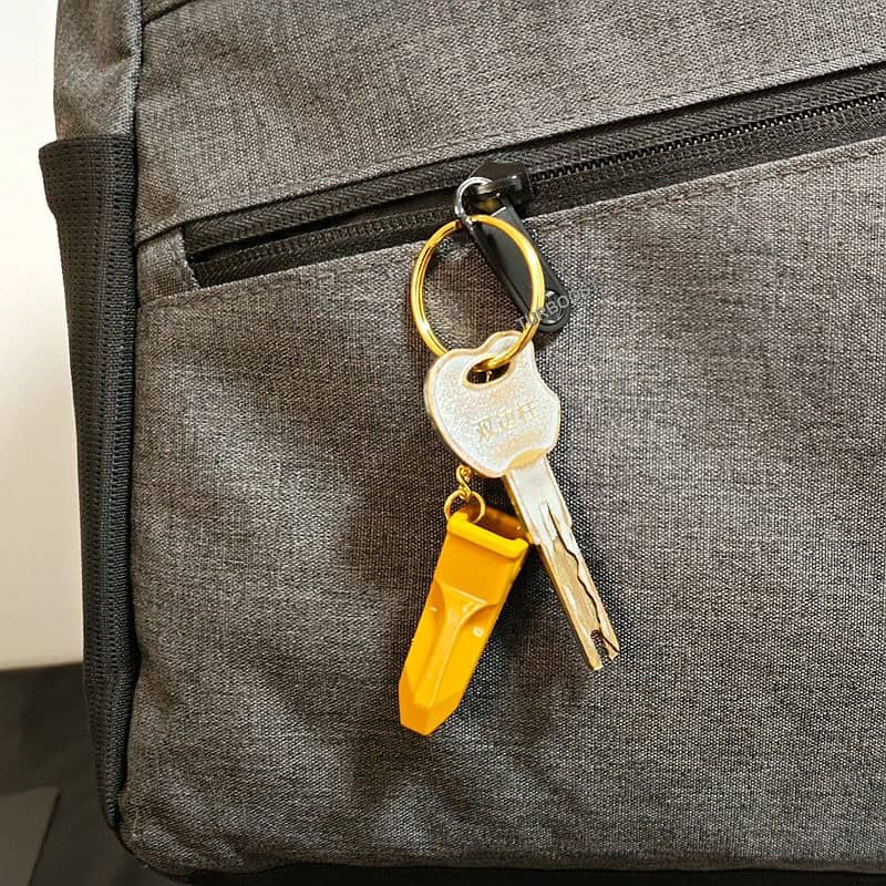 Yellow alloy excavator digger teeth keychain with a metal ring