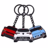 Three colorful metal sports car shaped keychains with keyrings: white, red, and blue with black details, highlighting their sleek design.