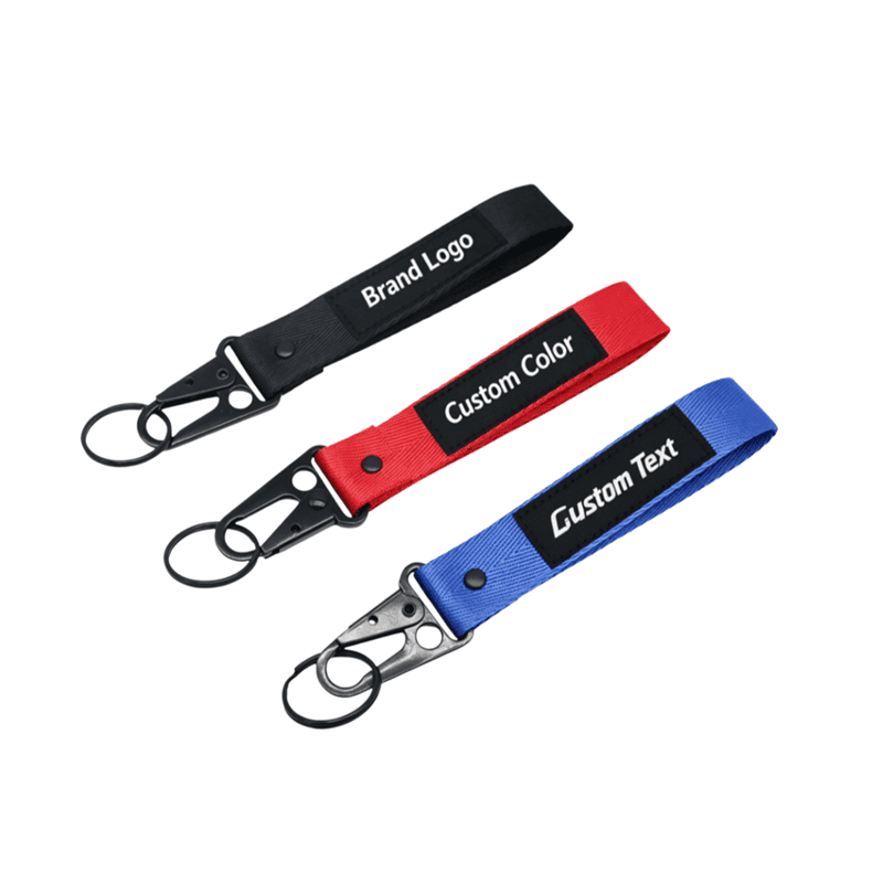 Set of black, red, and blue custom short loop jet tag keychains with metal lobster clips and custom branding.