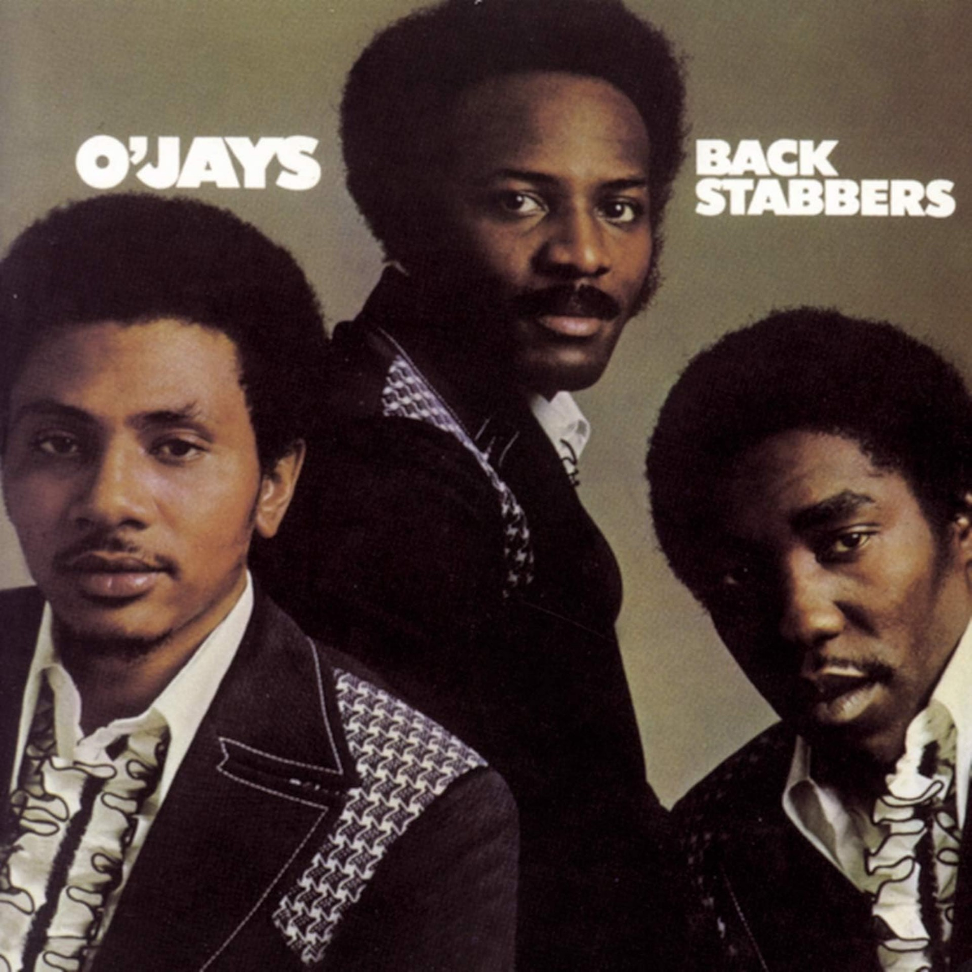 Back Stabbers album cover by The O’Jays featuring three band members in 1970s soul fashion.