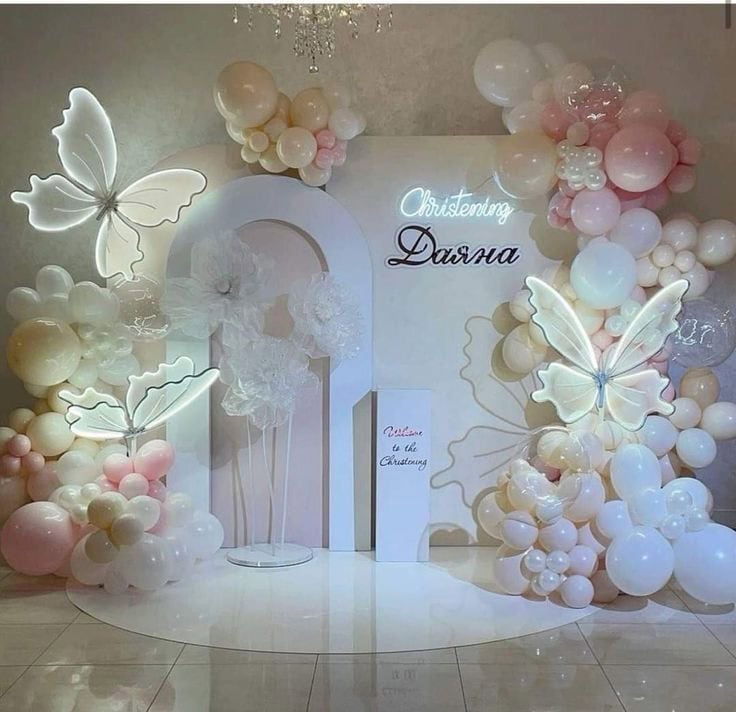 Elegant balloon display with butterflies for Christening celebration.