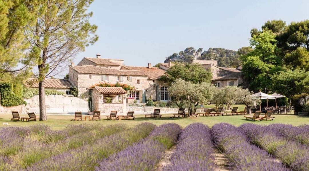 Scenic outdoor event venue surrounded by lavender and lush greenery, perfect for weddings.