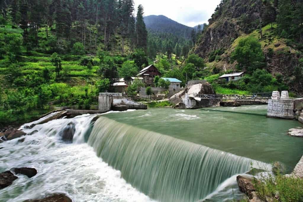Beautiful waterfall cascading in Pakistan's scenic mountain landscape.
