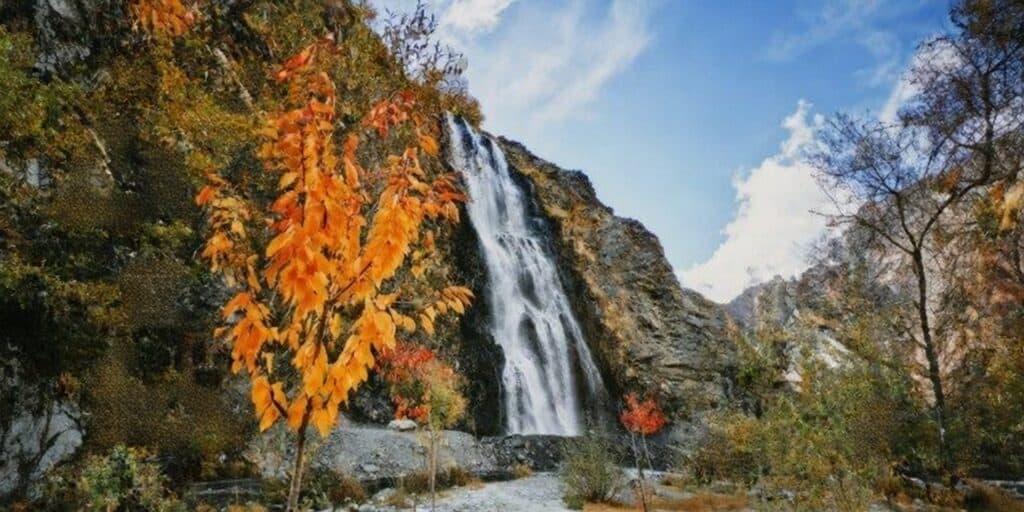 Hidden Waterfall in Pakistan's scenic mountains during autumn.