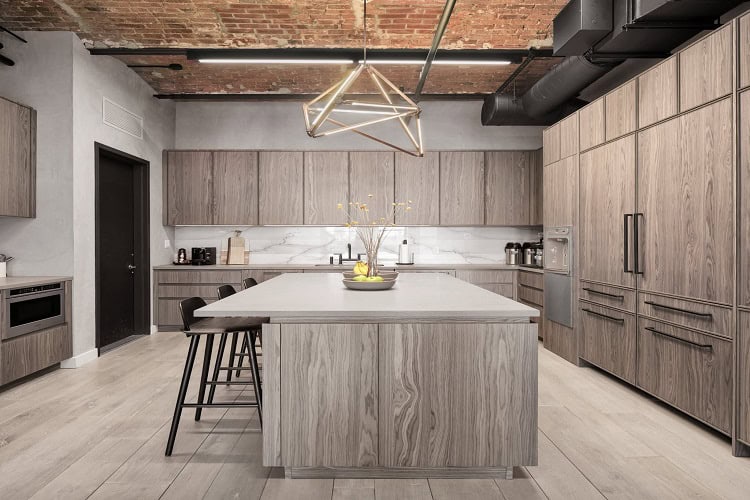 Urban Homes modern kitchen with wooden cabinetry and central island for contemporary living.