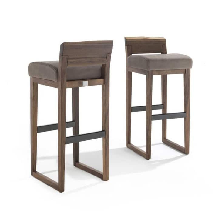 Stylish wooden bar stools with cushioned seats, perfect for contemporary urban kitchen or bar areas.