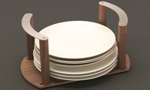 Elegant white ceramic plates stacked on a stylish wooden tray with handles, perfect for urban home d.