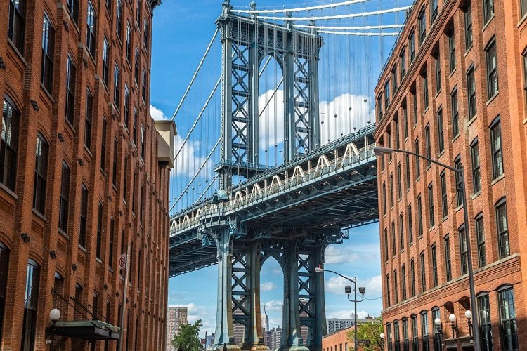 Iconic Manhattan Bridge view from Brooklyn neighborhood.