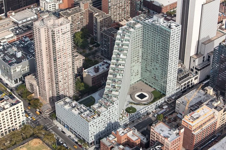 Urban Homes with innovative, curved design in a bustling cityscape.