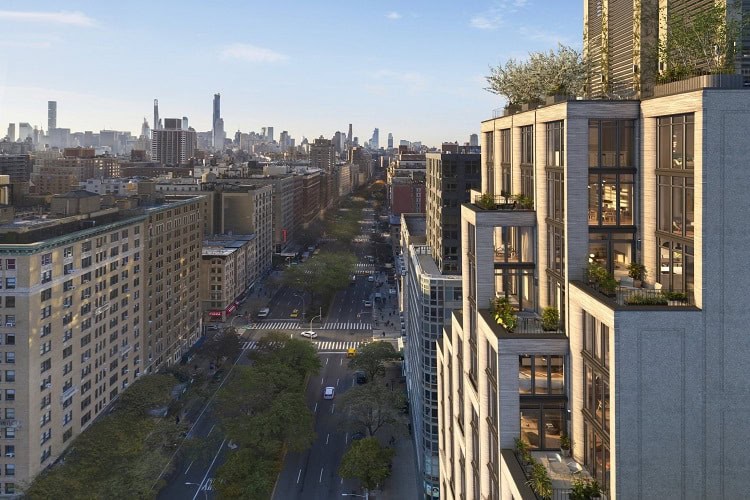 Contemporary urban apartment buildings with rooftop gardens in a cityscape.