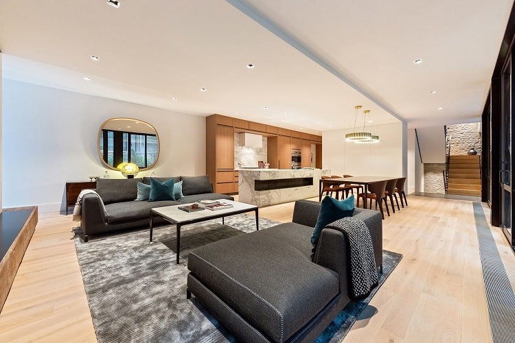 Spacious urban home interior featuring contemporary furniture, hardwood floors, and a cozy seating a.