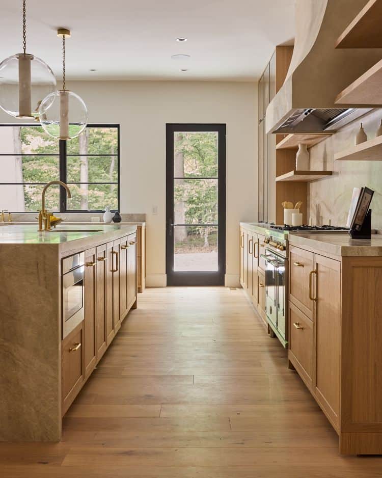 Bright transitional kitchen featuring natural wood cabinetry and sleek appliances.