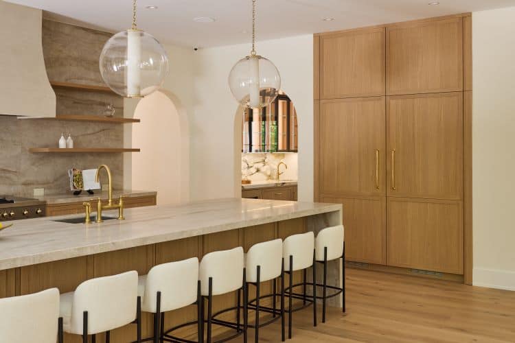 Elegant transitional kitchen with wooden cabinetry and marble countertops in Tenafly, NJ. Perfect bl.