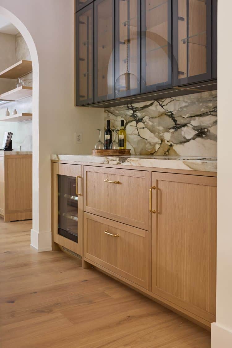 Elegant transitional kitchen with wooden cabinets and marble backsplash in Tenafly, NJ.