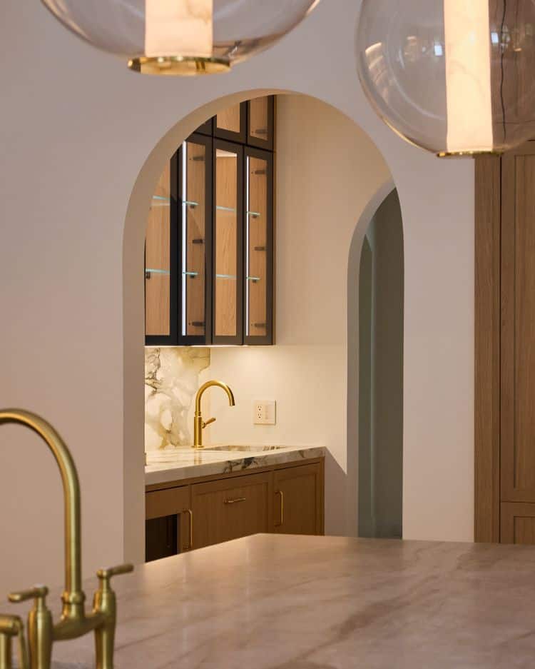 Stylish transitional kitchen featuring wood cabinets and gold accents in Tenafly, NJ.