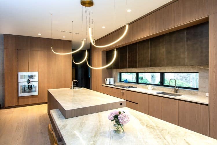 Elegant modern kitchen with custom wood cabinetry and sleek countertops in Cresskill, NJ.