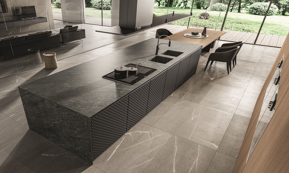 Urban Homes kitchen with sleek black island and minimalist design.