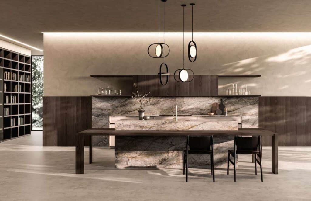 Contemporary urban kitchen featuring a marble island, pendant lights, and sleek cabinetry.
