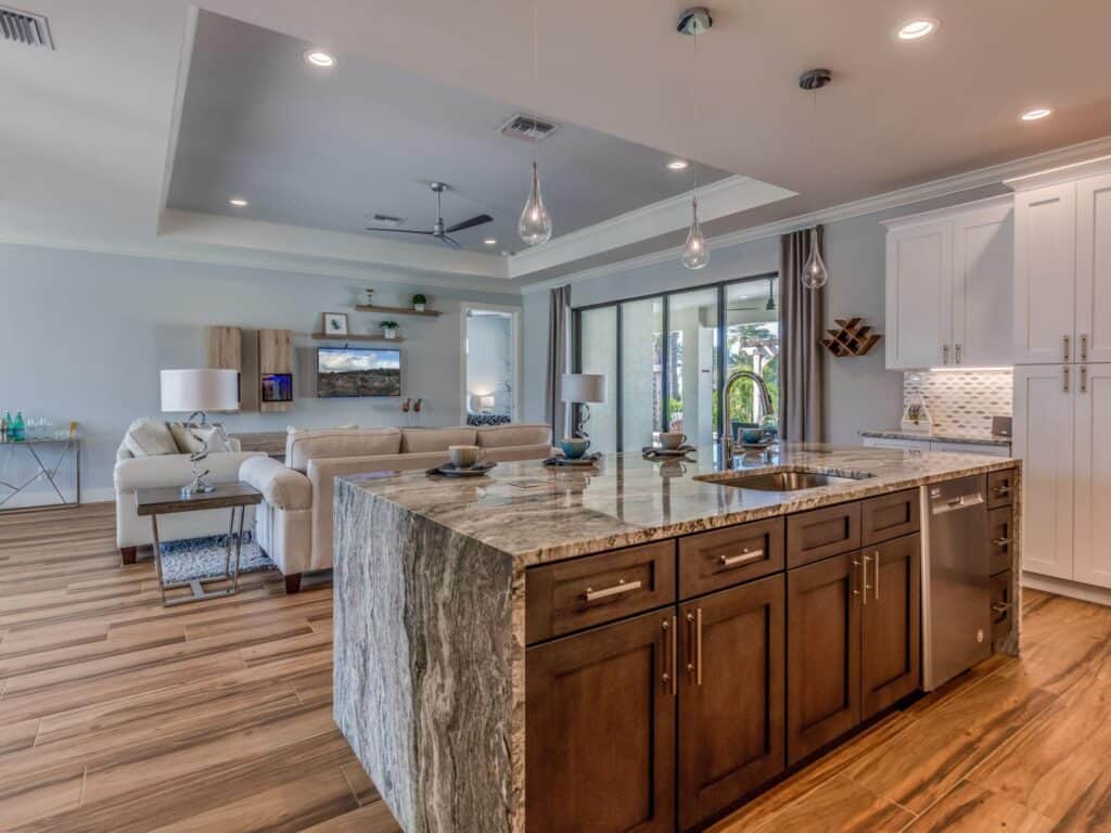 Spacious urban home interior featuring an open-concept living area and a stylish kitchen island with.