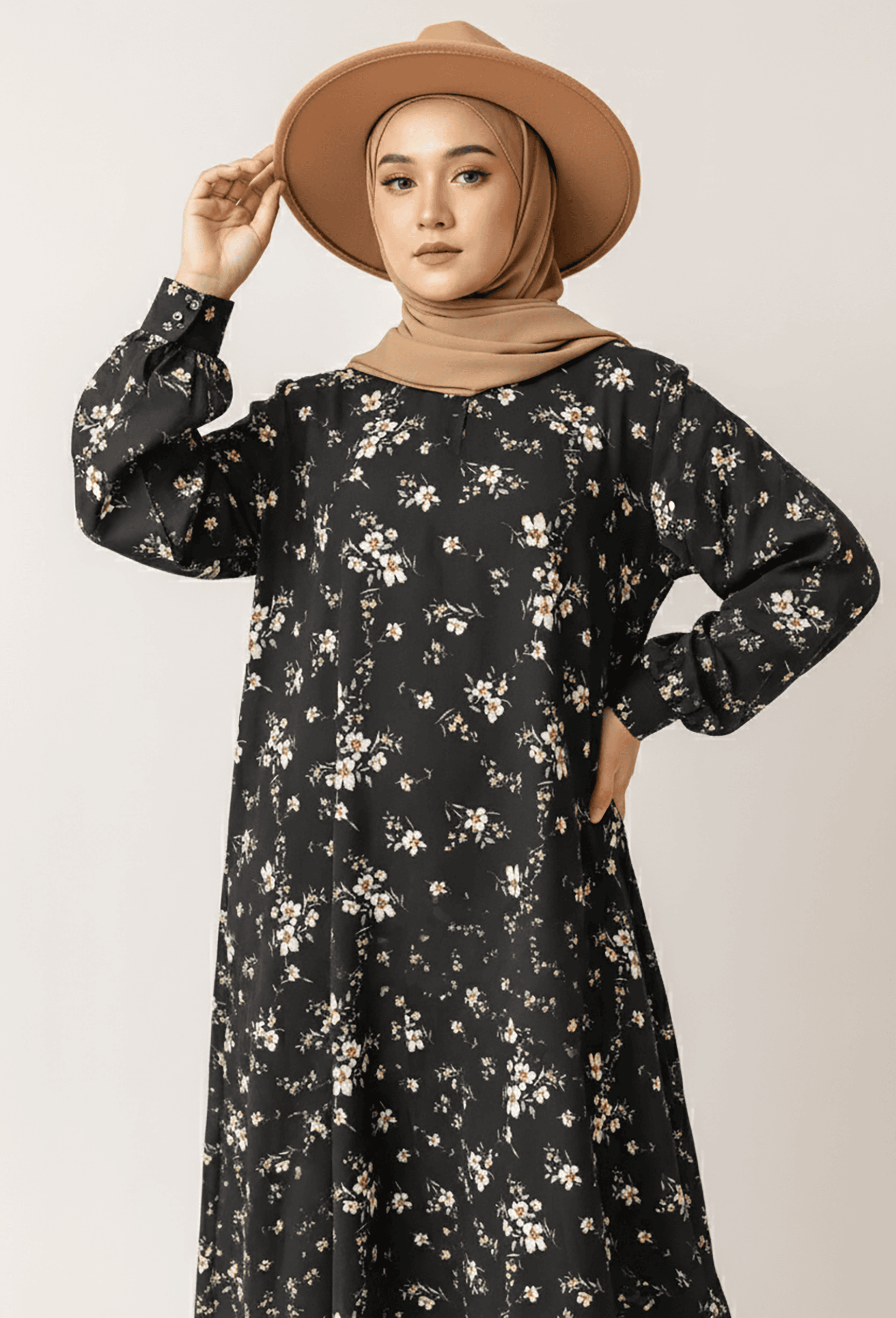 Woman in floral dress and wide-brim hat, modest fashion style, Umeed Designs.