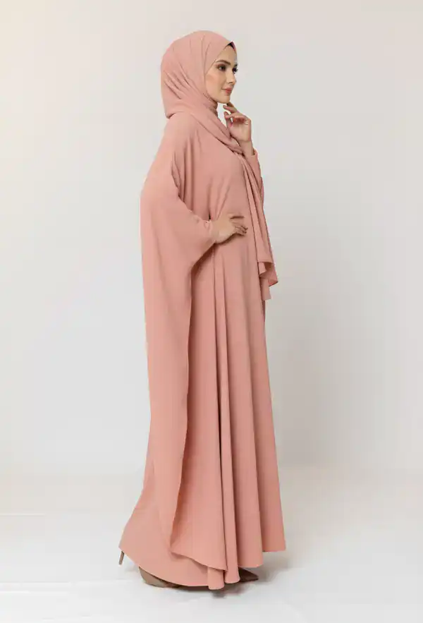 Elegant pink modest abaya with matching hijab, perfect for special occasions and cultural events.
