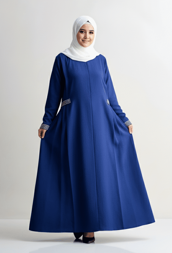 Elegant blue modest dress with intricate sleeve details, worn with a white hijab, perfect for specia.
