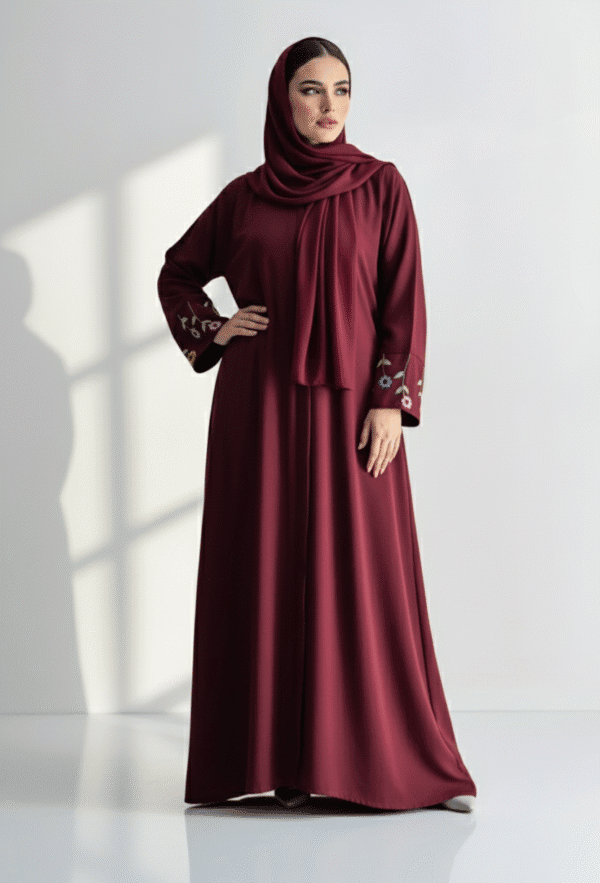Beautiful maroon abaya with embroidered sleeve details, modest and stylish for special occasions.