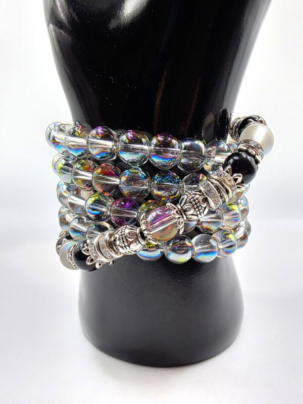 Bracelet with multicolored glass beads and silver accents, stylish jewelry accessory.