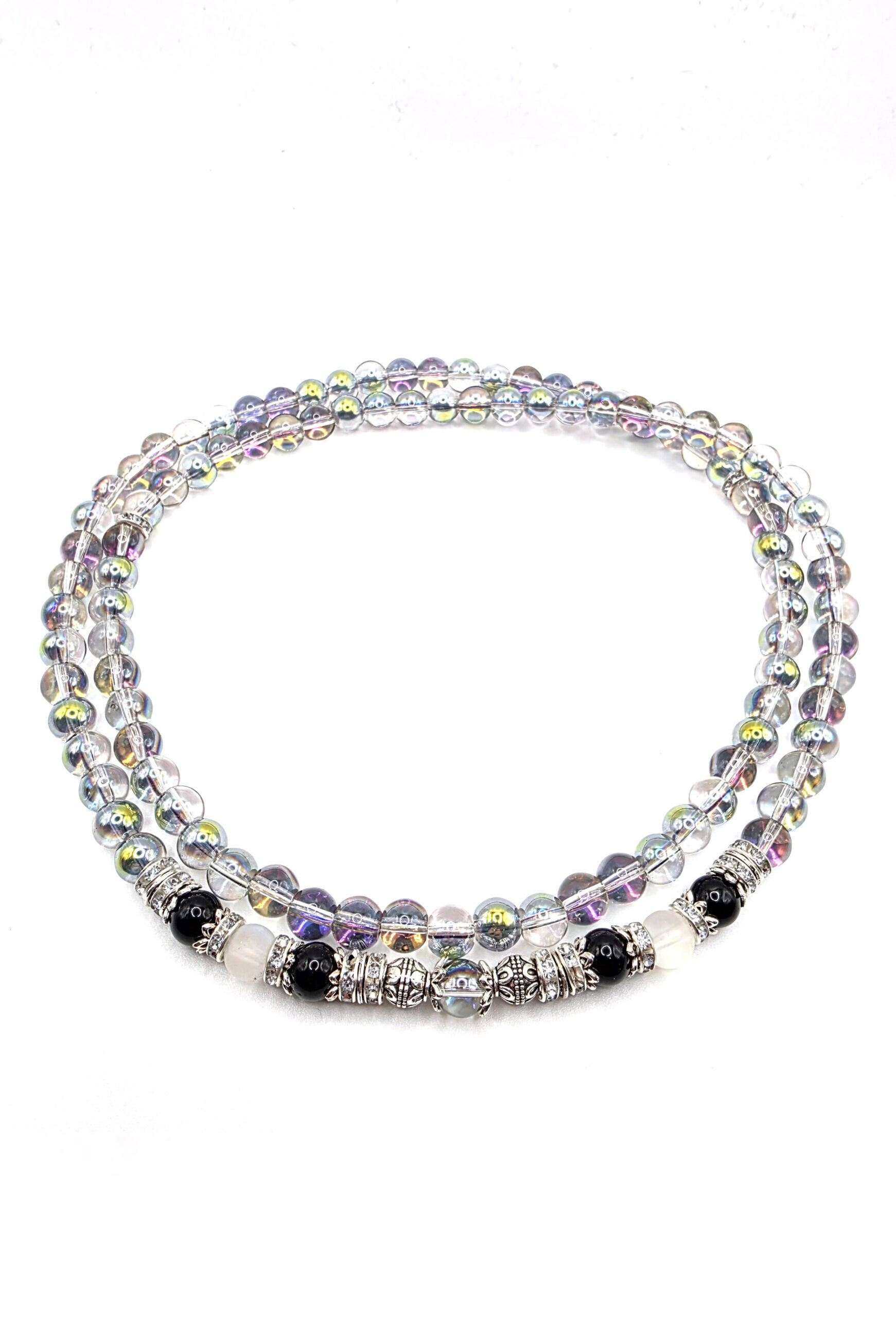Elegant beaded necklace featuring silver, black, and iridescent beads for a stylish accessory.