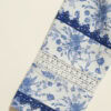 Beautiful blue and white floral fabric featuring lace details, perfect for elegant traditional garme.