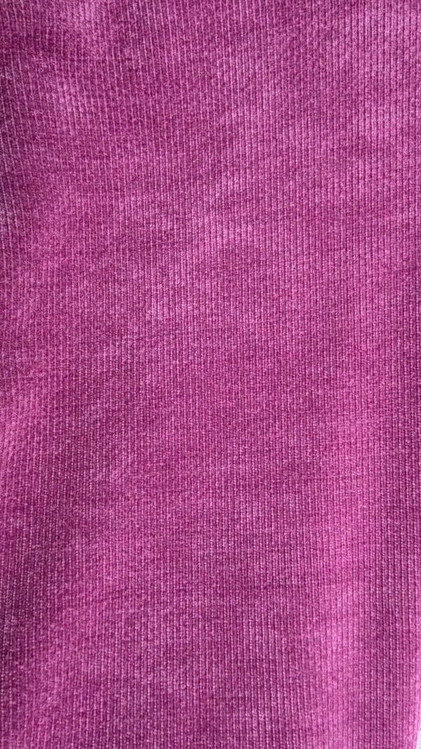 Pink knitted fabric texture, ideal for fashion, textiles, and craft projects.