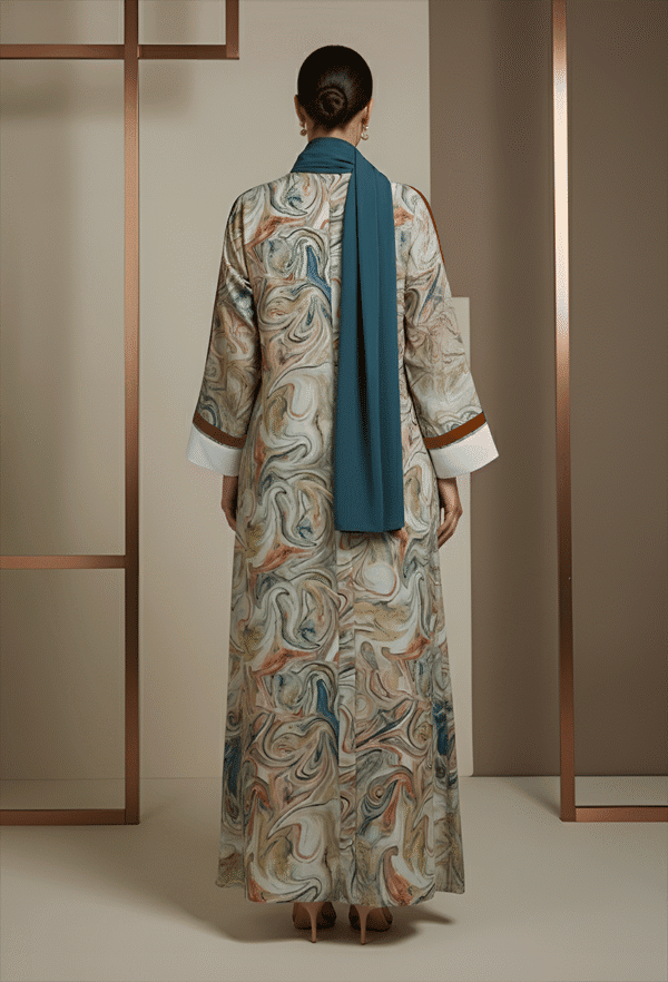 Elegant marble-patterned abaya with blue scarf, stylish and modest fashion for women.