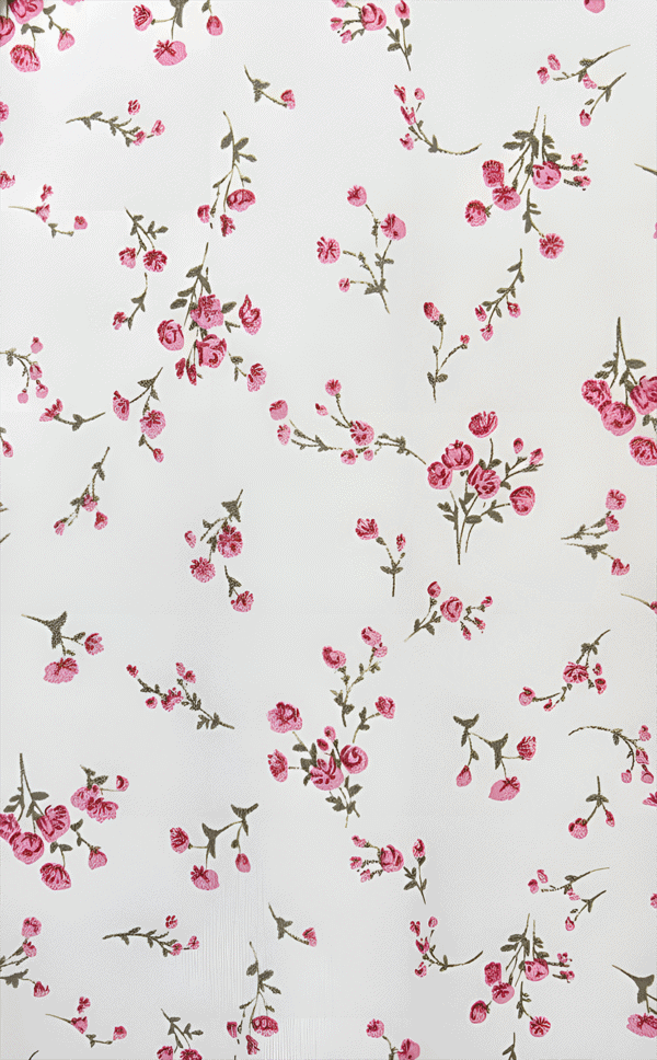 Pink floral fabric with small blossoms and green leaves on a white background.