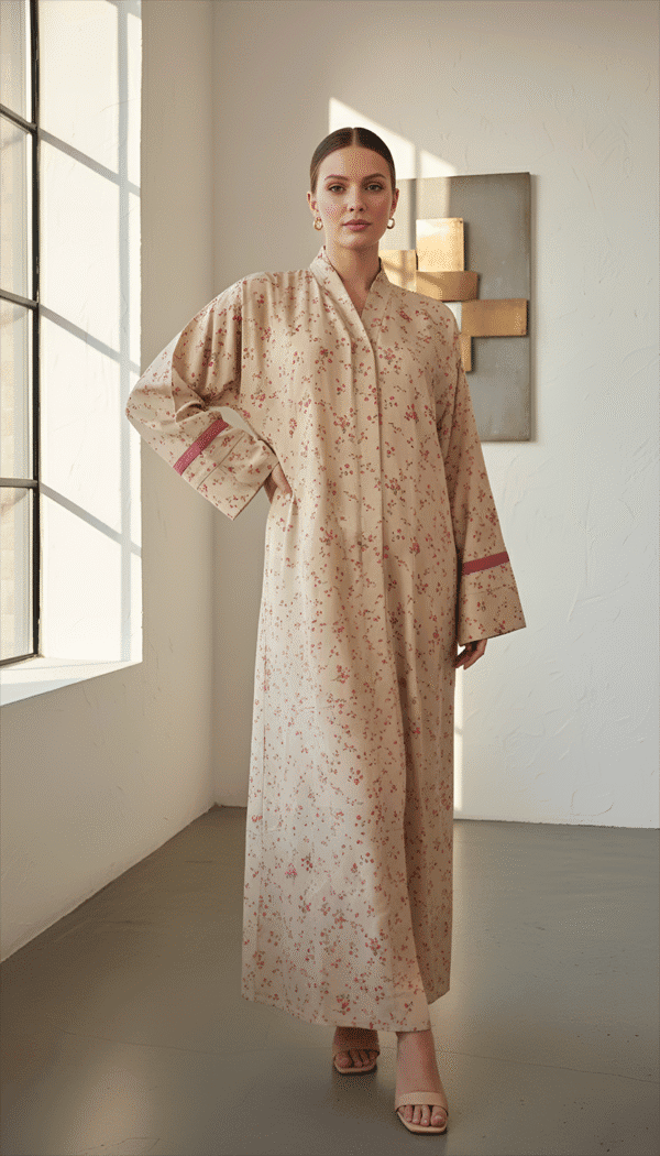 Woman wearing a beige floral maxi dress with long sleeves and a high neckline.