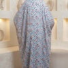 Elegant floral abaya with matching hijab, displayed in a modern, minimalist setting. Perfect for mod.