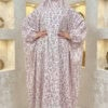 Elegant floral abaya with matching hijab for women, featuring a modest design and intricate pink and.