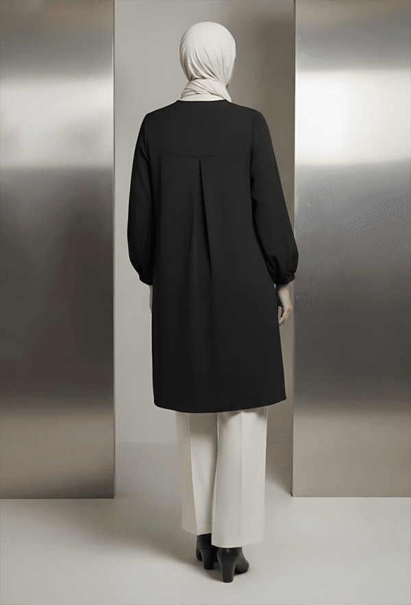 Elegant black abaya with white trousers and hijab, perfect for modern modest fashion and cultural at.