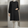 Elegant modest black tunic with white wide-leg pants and white hijab for women.