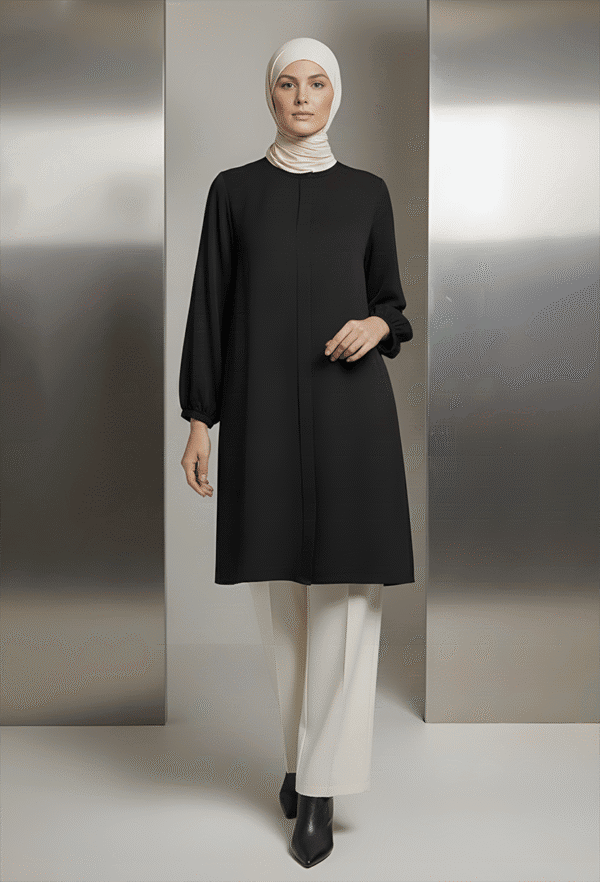 Elegant modest black tunic with white wide-leg pants and white hijab for women.