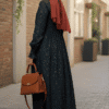 Modest navy blue dress with floral pattern, paired with a rust-colored hijab and matching handbag, p.