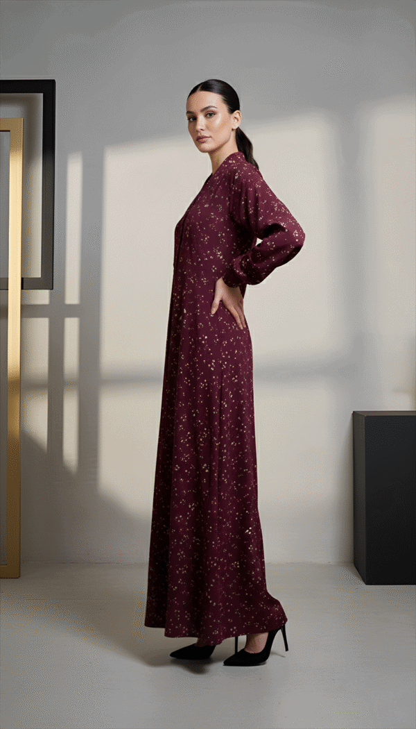 Elegant maroon maxi dress with gold floral patterns, perfect for formal occasions and stylish events.