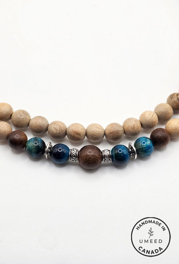 Beaded handmade necklace with wooden and blue glass beads, crafted by Umeed Designs.