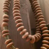 Handmade wooden beaded necklace with natural wood tones and gold accents, crafted by Umeed Designs i.