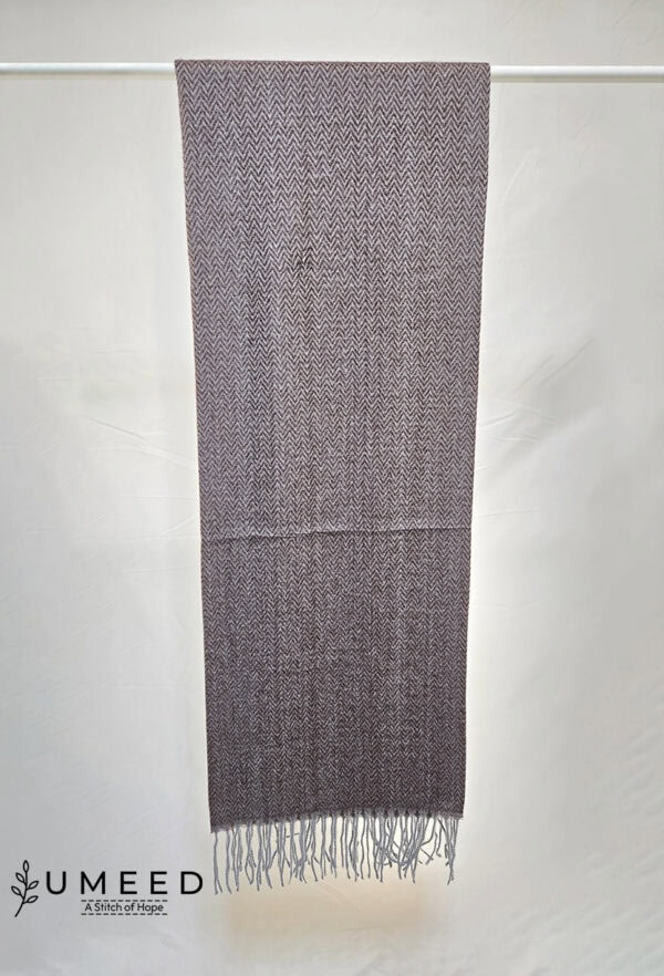 Elegant handwoven wool scarf with intricate patterns, perfect for stylish winter accessories.