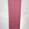 Handwoven pink and white textile scarf displayed on a white background.