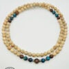 Handmade wooden beaded necklace with blue and brown accents, perfect for casual or boho style.
