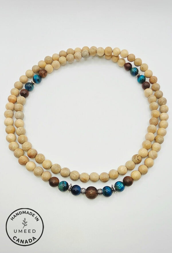 Handmade wooden beaded necklace with blue and brown accents, perfect for casual or boho style.