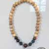 Beaded wooden necklace with natural and dyed beads, handmade jewelry from Umeed Designs.