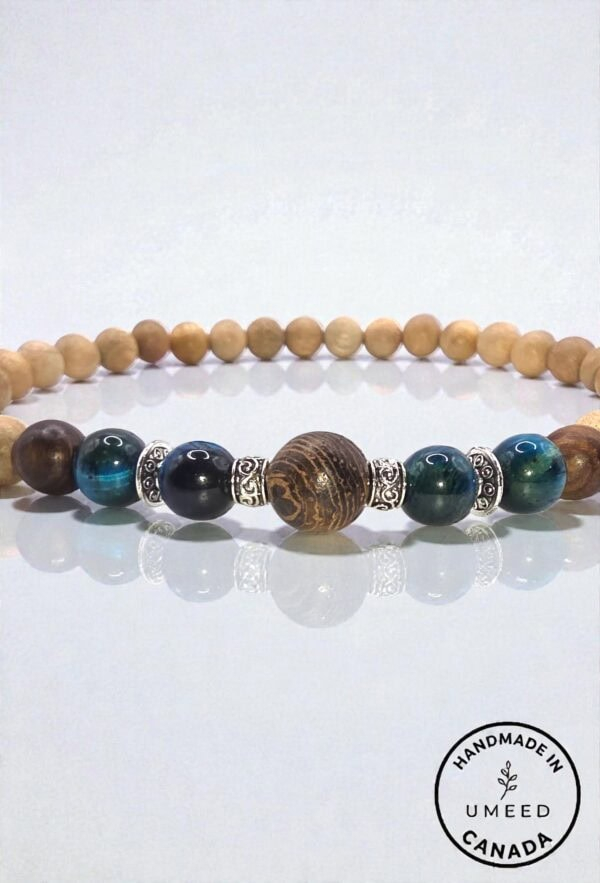 Handmade beaded bracelet featuring wooden, metal, and gemstone beads from Umeed Designs.